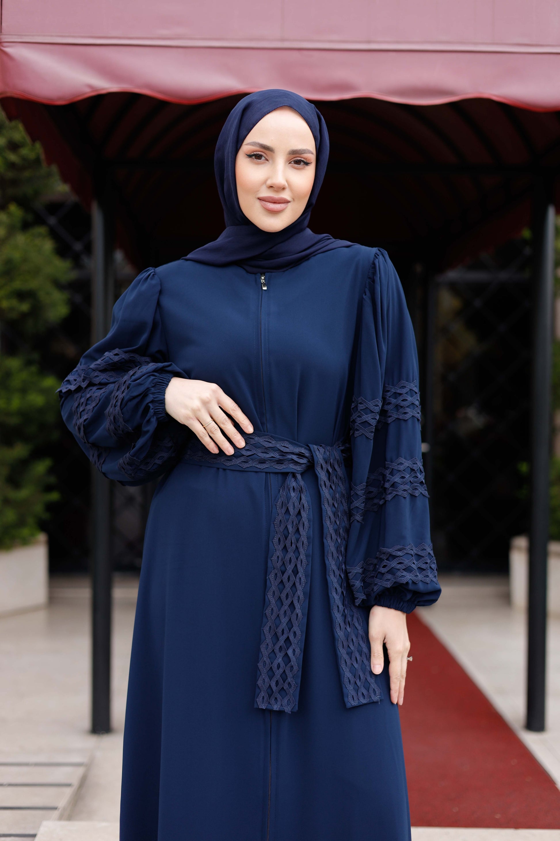 Elegant navy blue Medine İpeği Ferace with lace details and a stylish belt, creating a sophisticated and comfortable look.